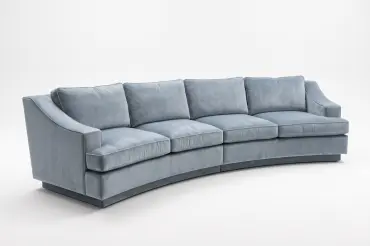Sweeping Curvature and sloping arm sofa over 10 feet long. Fully upholstered plinth base. Made in 2 pieces to get into tight spaces